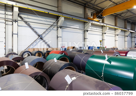 Photo shot of rolls of steel sheet stored in warehouse; Cold rolled steel coils at the factory Photo shot of rolls of steel sheet stored in warehouse; Cold rolled steel coils at the factory 86037799