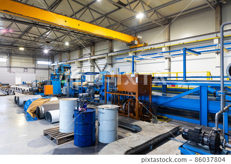 Photo shot of rolls of steel sheet stored in warehouse; Cold rolled steel coils at the factory 86037804