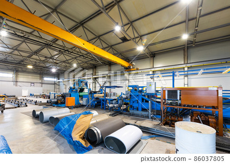 Photo shot of rolls of steel sheet stored in warehouse; Cold rolled steel coils at the factory Photo shot of rolls of steel sheet stored in warehouse; Cold rolled steel coils at the factory 86037805