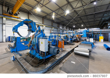 Photo shot of rolls of steel sheet stored in warehouse; Cold rolled steel coils at the factory Photo shot of rolls of steel sheet stored in warehouse; Cold rolled steel coils at the factory 86037807