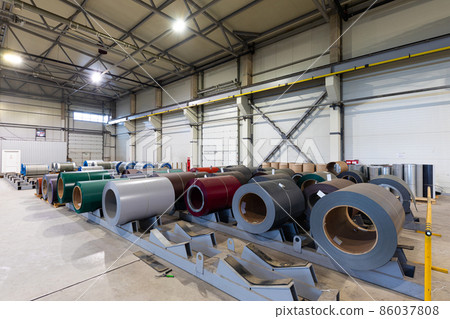 Photo shot of rolls of steel sheet stored in warehouse; Cold rolled steel coils at the factory 86037808