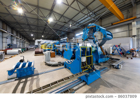 Photo shot of rolls of steel sheet stored in warehouse; Cold rolled steel coils at the factory 86037809