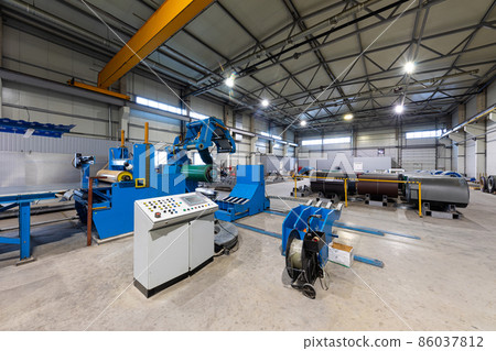 Photo shot of roll of painted galvanized steel sheet at cutting machine, ironworks and metalwork in Photo shot of roll of painted galvanized steel sheet at cutting machine, ironworks and metalwork in 86037812