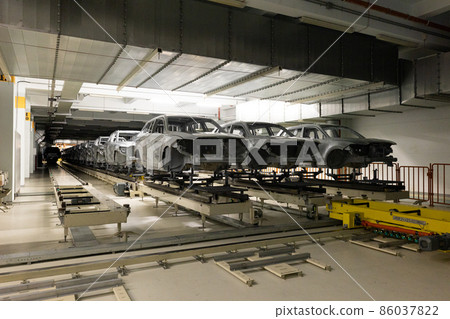 Car bodies are on assembly line. Modern automotive industry. Automobile conveyor Car bodies are on assembly line. Modern automotive industry. Automobile conveyor 86037822