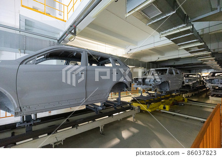 Car bodies are on assembly line. Modern automotive industry. Automobile conveyor Car bodies are on assembly line. Modern automotive industry. Automobile conveyor 86037823