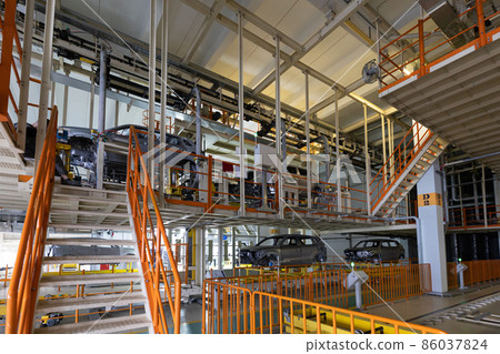 Automobile production line. Welding car body. Modern car assembly plant. Auto industry. Interior of Automobile production line. Welding car body. Modern car assembly plant. Auto industry. Interior of 86037824