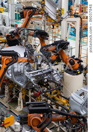 Vertical photo of automobile production line. Modern car assembly plant. Auto industry. Interior of Vertical photo of automobile production line. Modern car assembly plant. Auto industry. Interior of 86037848
