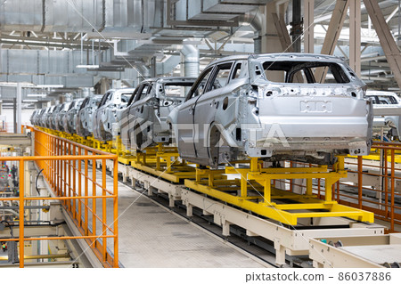 Photo of automobile production line. Welding car body. Modern car assembly plant. Auto industry 86037886