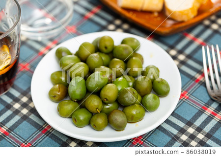 Pickled green olives with a stone Pickled green olives with a stone 86038019