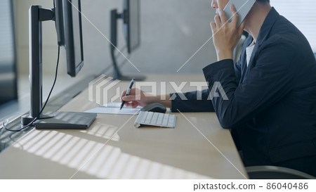 Hands of a man typing 86040486