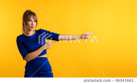 Woman pointing index fingers Woman pointing index fingers 86041661