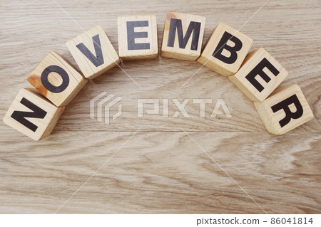 november alphabet letters on wooden background 86041814