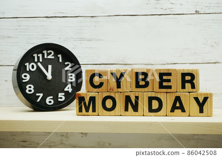 Cyber Monday sale shopping concept alphabet letter and alarm clock on wooden background Cyber Monday sale shopping concept alphabet letter and alarm clock on wooden background 86042508