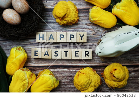 Happy Easter with flower, rabbit and easter eggs decoration on wooden background 86042538