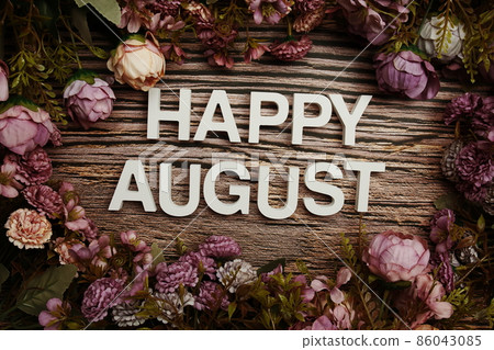 Happy August alphabet letters with flowers frame on wooden background 86043085