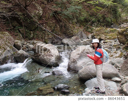 Mountain stream fishing Mountain stream fishing 86043651