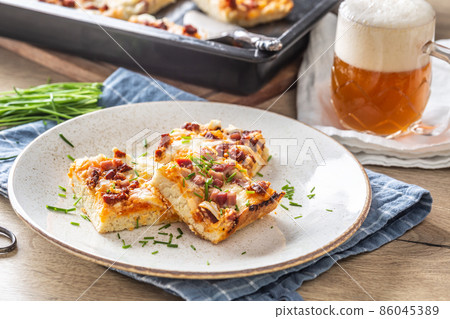 Slovak national dish podpecnik, podplamennik or posuch. Slovak national dish is made sourdough, bryndza, sour cream, bacon and onion Slovak national dish podpecnik, podplamennik or posuch. Slovak national dish is made sourdough, bryndza, sour cream, bacon and onion 86045389