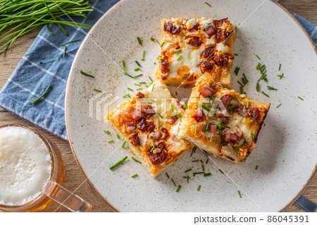 Slovak national dish podpecnik, podplamennik or posuch. Slovak national dish is made sourdough, bryndza, sour cream, bacon and onion 86045391