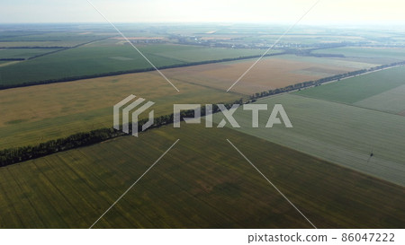 Aerial drone view flight over different agricultural fields Aerial drone view flight over different agricultural fields 86047222