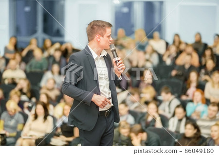 Speaker at Business convention and Presentation. Speaker at Business convention and Presentation. 86049180