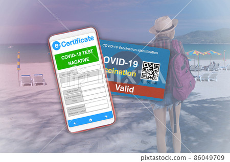 Covid-19 vaccination certificate on mobiel and card for traveling. 86049709