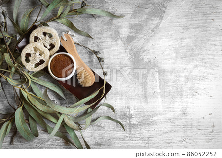 Flat lay spa composition with body products on textured concrete background. Flat lay spa composition with body products on textured concrete background. 86052252
