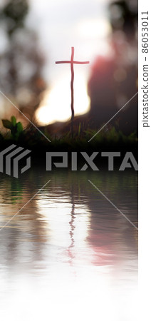 The holy cross of Jesus Christ by the calm waters and waves and space for text on a light background The holy cross of Jesus Christ by the calm waters and waves and space for text on a light background 86053011
