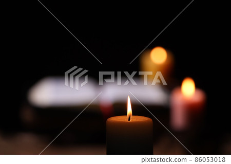 A comfortable candle, a holy bible, and a time of holy words and meditation A comfortable candle, a holy bible, and a time of holy words and meditation 86053018