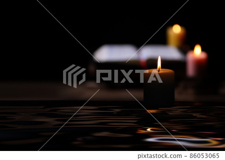 A comfortable candle, a holy bible, and a time of holy words and meditation A comfortable candle, a holy bible, and a time of holy words and meditation 86053065