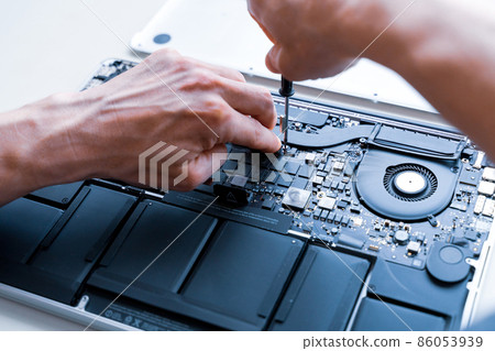 Computer motherboard. Pc technician repair service with laptop on hardware technology background. Maintenance engineer support. Developer soldering electronic component. Computer motherboard. Pc technician repair service with laptop on hardware technology background. Maintenance engineer support. Developer soldering electronic component. 86053939
