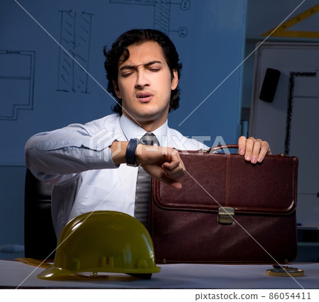 The young construction architect working on project at night 86054411