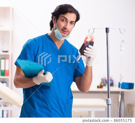 The young male doctor in blood transfusion concept The young male doctor in blood transfusion concept 86055173