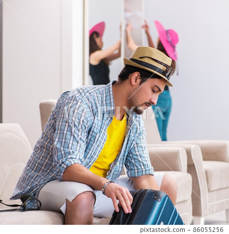 Young family packing for vacation travel Young family packing for vacation travel 86055256