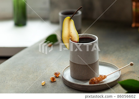 Mug of coffee decorated pear slice, nobody Mug of coffee decorated pear slice, nobody 86056602