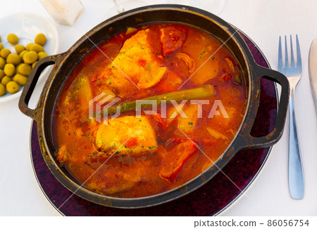 Baked merluse with vegetables and tomato sauce 86056754