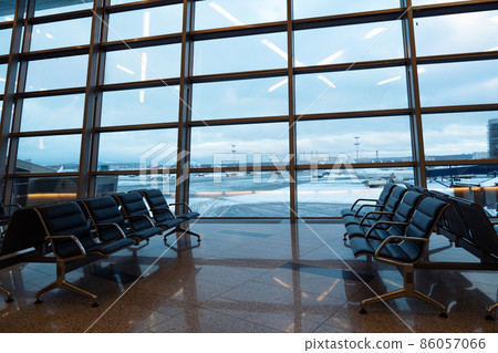 Empty seats at departure lounge, no people. International airport interior 86057066