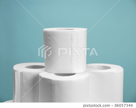 A lot of toilet paper on blue background. Panic buying 86057349