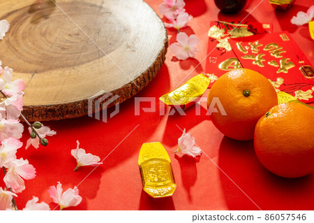Flat lay mockup for holiday Chinese new year red packet and gold accessories blossom and Lunar festival background, means wealthy or rich and happiness. Flat lay mockup for holiday Chinese new year red packet and gold accessories blossom and Lunar festival background, means wealthy or rich and happiness. 86057546