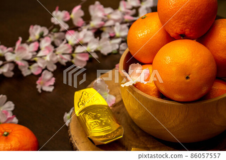 Flat lay mockup for holiday Chinese new year red packet and gold accessories blossom and Lunar festival background, means wealthy or rich and happiness. Flat lay mockup for holiday Chinese new year red packet and gold accessories blossom and Lunar festival background, means wealthy or rich and happiness. 86057557