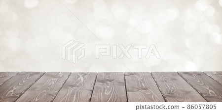 Brown wooden table and white bokeh for background Brown wooden table and white bokeh for background 86057805