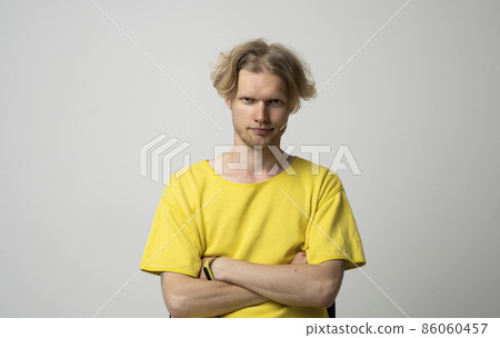 Closeup portrait of skeptical man looking suspicious, some disgust on his face mixed with disapproval isolated on gray background. Negative human emotions, facial expressions, feelings. Closeup portrait of skeptical man looking suspicious, some disgust on his face mixed with disapproval isolated on gray background. Negative human emotions, facial expressions, feelings. 86060457