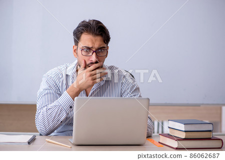 Young male teacher in telestudy concept Young male teacher in telestudy concept 86062687