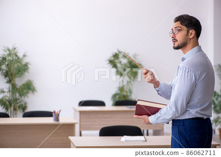 Young male teacher in the classroom 86062711