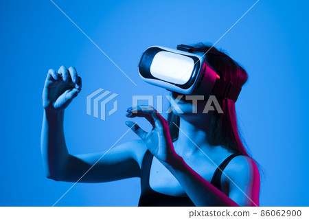 Female engineer wearing virtual reality headset designing a new pruducts or technologis using VR technology. Development and prototyping software. 86062900