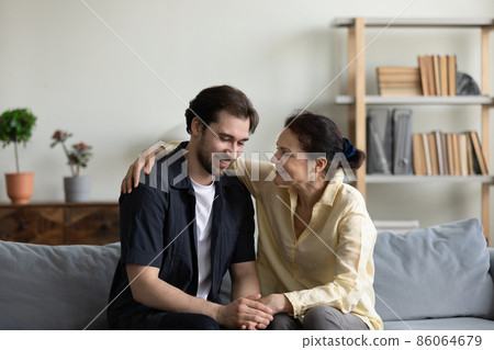 Happy old retired woman communicating with son. Happy old retired woman communicating with son. 86064679