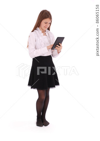 Beautiful young woman holding digital tablet Beautiful young woman holding digital tablet 86065158