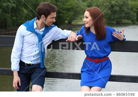 Happy couple meeting near river and greeting each other. 86065598