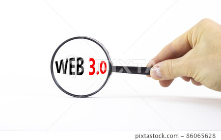 WEB 3.0 symbol. Concept words WEB 3.0. Magnifying glass. Beautiful white table, white background. Businessman hand. Copy space. Business, technology and WEB 3.0 concept. 86065628