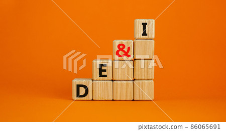 DEI, Diversity, equity and inclusion symbol. Concept words DEI, diversity, equity and inclusion on wooden cubes on beautiful orange background. Business, DEI, diversity, equity and inclusion concept. 86065691