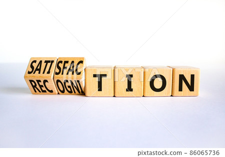 Satisfaction and recognition symbol. Turned wooden cubes and changed the word recognition to satisfaction. Beautiful white background, copy space. Businesss satisfaction and recognition concept. 86065736